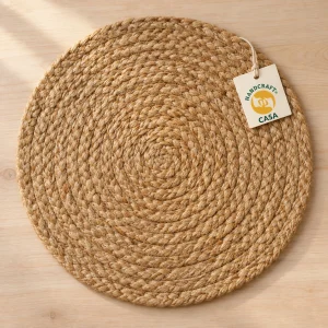 Round braided jute placemat with a removable Casa presentation tag.