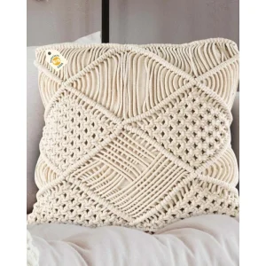 Cream cushion with large raised diagonal bands and open cord sections on upholstered seating.