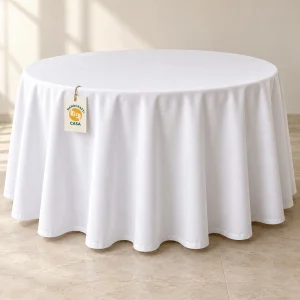 White poly-cotton banquet tablecloth draped over a round table with a removable Casa tag.