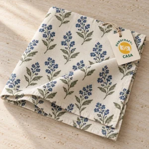 Folded floral printed cotton napkin with a removable Casa presentation tag.
