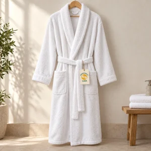 White terry shawl collar bathrobe on a hanger with a removable Casa tag.