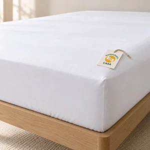 White Fitted Hotel Bed Sheet with a removable Casa presentation tag.