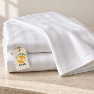 White Satin Stripe Hotel Bed Sheet with a removable Casa presentation tag.