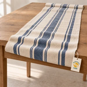 Cream and blue striped cotton table runner with folded ends and a removable Casa paper tag.